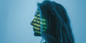 A futuristic photo of a woman looking forwards to the left side with binary codes projected onto her face.